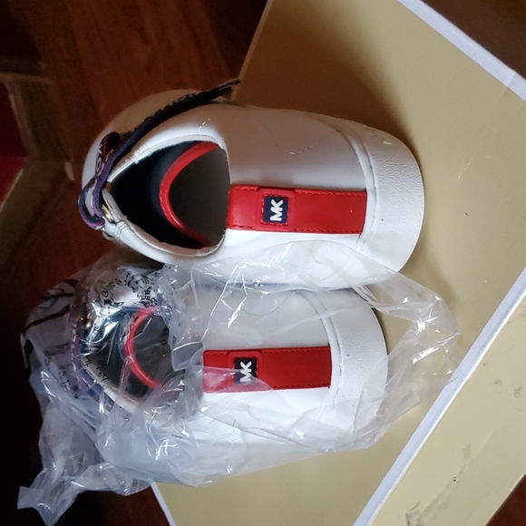 mk sneakers. color  white with logo across  in red n blue. - Picture 3 of 4